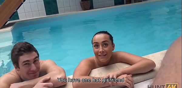 HUNT4K. Slim brunette has sex with stranger by the pool near her man